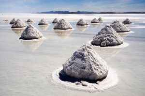 piles of salt being harvested on the Salar de Uyuni