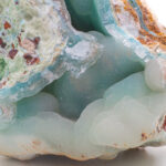 Blue smithsonite mineral on white background.