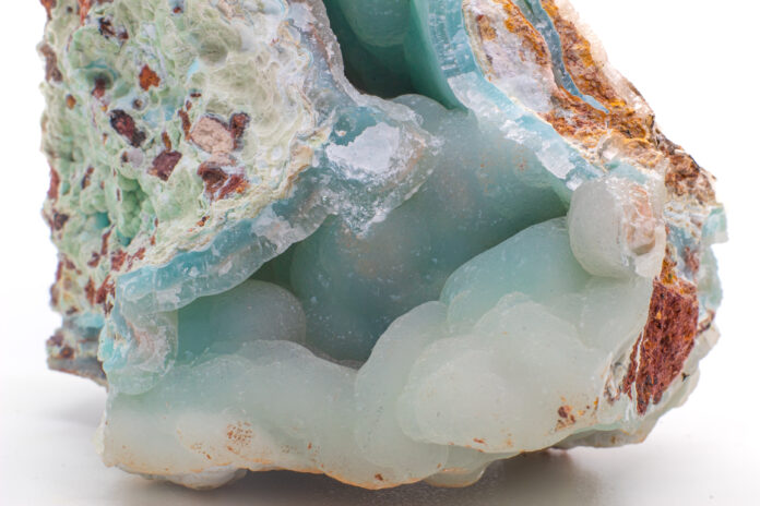 Blue smithsonite mineral on white background.