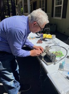 sawing off the rough base of the crystal