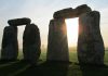 pairs stonehenge stones with the sun shining through
