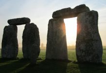 pairs stonehenge stones with the sun shining through