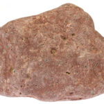 rhyolite from the Baltic Sea coast in Waabs, Germany isolated on white background