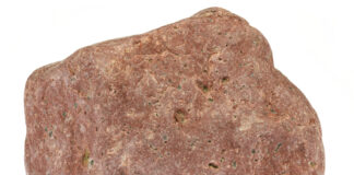 rhyolite from the Baltic Sea coast in Waabs, Germany isolated on white background