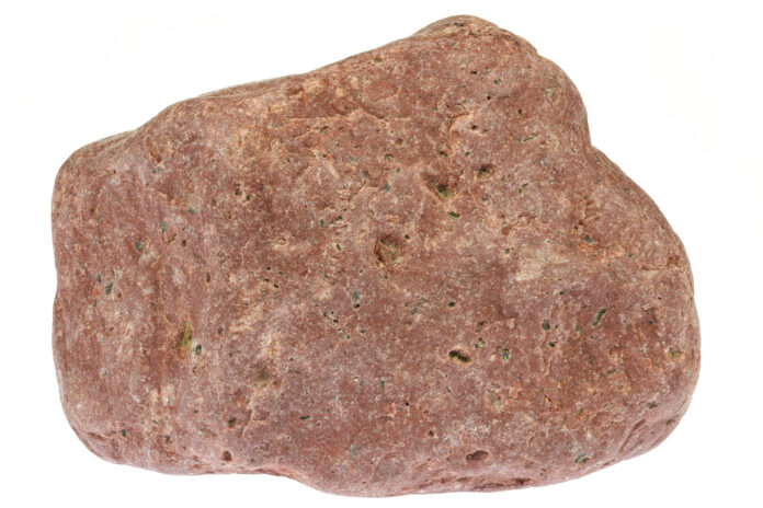 rhyolite from the Baltic Sea coast in Waabs, Germany isolated on white background