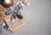 Gifts for Rockhounds: Top Ideas A a rock collecting gift box wrapped by brown paper with christmas theme decoration on stone floor.