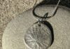 silver dollar pendant made with precious metal clay