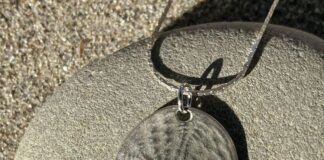 silver dollar pendant made with precious metal clay