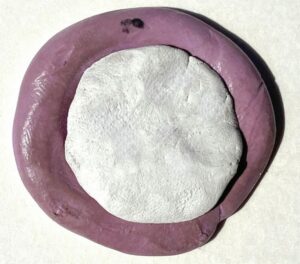 silver dollar pendant being made with precious metal clay silver