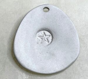 stamped pendant made with metal stamps