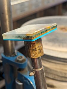 three layers of agate being put together to be ready for faceting