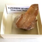 Rock Collecting: How to Get Started tangerine quartz in a rock collection box