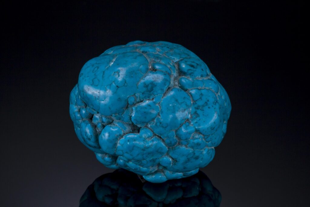 What is turquoise is easy to see in this round, blue nodule.