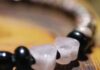 Beaded Necklaces: A Gem Design Guide gem beaded necklaces are customizable like this one strung with black and white beads