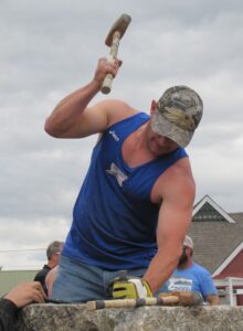 Single-jack hardrock mining competition demands strength, stamina, and perfect hand-eye coordination.