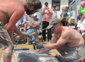 Double-jacking during hardrock mining contests demands perfect coordination between the hammer man and the shaker.
