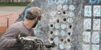 This jackleg hardrock mining contest competitor is attempting to collar a hole within a small designated area.