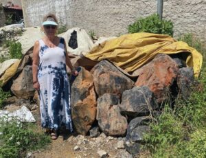Person standing by Mexican obsidian boulders