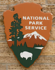 A National Park Service sign shows the conservation legacy of U.S. presidents and geology.