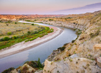 Presidents and Geology Theodore Roosevelt National Park, shown here as landscape with a road running through it, is part of the history of U.S. presidents and geology.