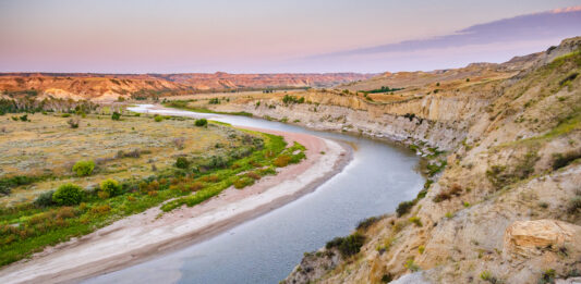 Presidents and Geology Theodore Roosevelt National Park, shown here as landscape with a road running through it, is part of the history of U.S. presidents and geology.
