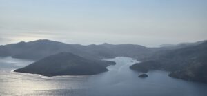 Ithaca, Greece, is known from Homer as the beloved homeland of Odysseus. The port of Vathy is seen sheltered in the bay.