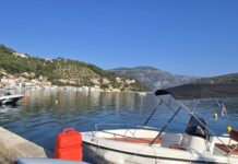 The picturesque capital of Ithaca, Greece, and the main port of Vathy. In the background is the road leading high up to the Monoliths.