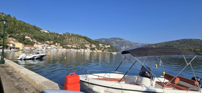 Ithaca, Greece The picturesque capital of Ithaca, Greece, and the main port of Vathy. In the background is the road leading high up to the Monoliths.