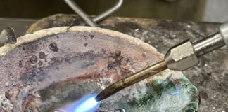 Scrap gold is being melted together with the new 24k gold and master alloy.