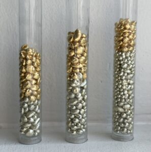 Three tubes showing different types of gold alloy.