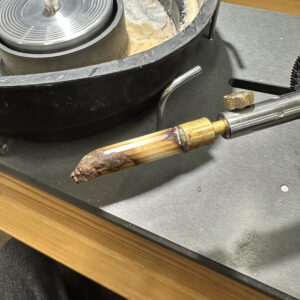 Girdle on walrus tooth cabochon made by free-hand faceting