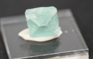 Green fluorite crystal showing cleavage planes.