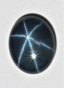 The star in star sapphire is an example of cat’s eye mineral properties with mineral fibers running in three directions.
