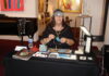 10 Lapidary Business Tips for Artists & Vendors Helen Serras-Herman at her lapidary business booth at an art gallery.