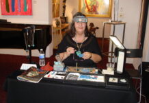 10 Lapidary Business Tips for Artists & Vendors Helen Serras-Herman at her lapidary business booth at an art gallery.