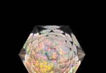 Faceted quartz galaxy gem with a "star burst" crown.