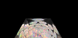 Faceted quartz galaxy gem with a "star burst" crown.