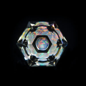 Faceted quartz galaxy gemstone with a "New World" crown.