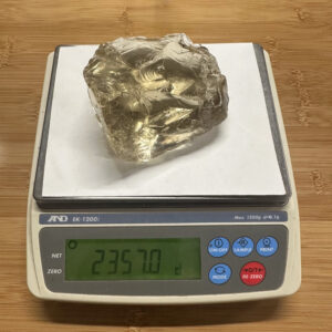 Rough smoky quartz being weighed before gem cutting.