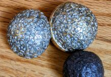 Enterolith, alongside a copy of a 17th-century India (Mughal Period) round pill box adapted from a silver case, cast in lead-free pewter, electroplated with 24-carat gold and coated with a silver lacquer to create a two-toned effect.
