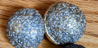 Madstones: The Strange Folk Remedy for Rabies Enterolith, alongside a copy of a 17th-century India (Mughal Period) round pill box adapted from a silver case, cast in lead-free pewter, electroplated with 24-carat gold and coated with a silver lacquer to create a two-toned effect.