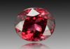 Faceted red spinel gemstone.