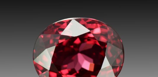 Cursed Gemstones: The Black Prince’s Ruby and More Faceted red spinel gemstone.